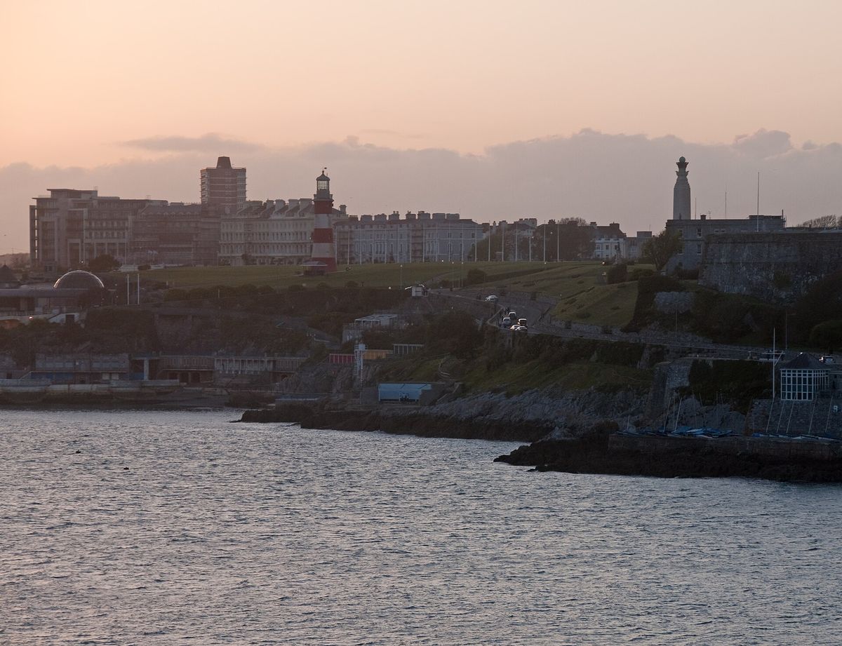 Plymouth Hoe and Smeaton's Tower at sunset, seen across the water